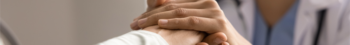 Doctor holding a patient's hand